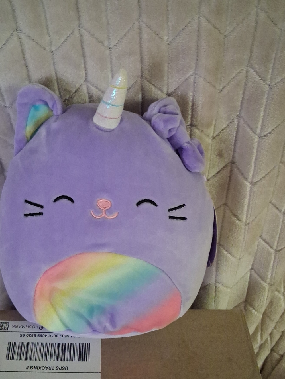 Squishmallows Cienna The Purple Unicorn Cat with Pastel Rainbow Belly.